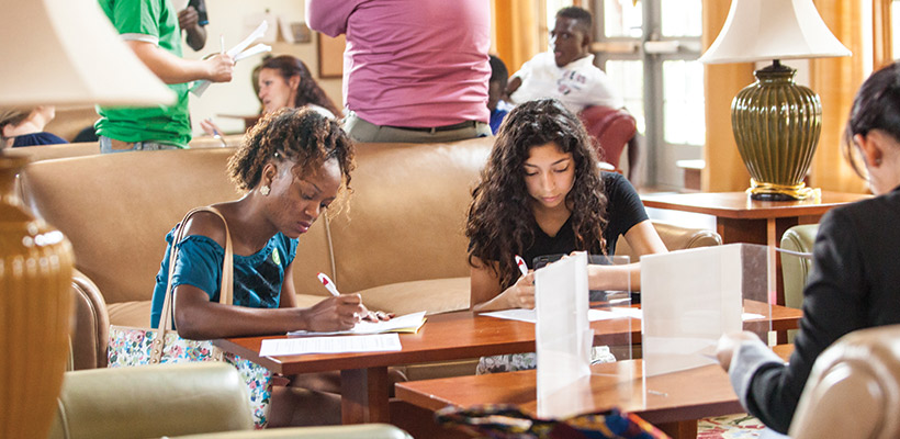 Bryn Athyn College students filling out student employment applications in the Brickman Center