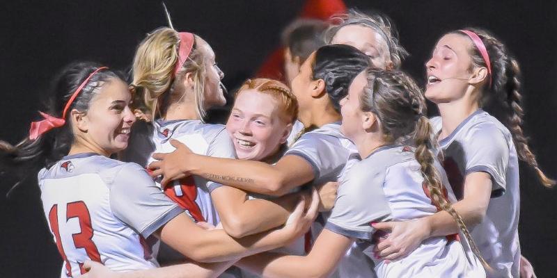 The soccer team celebrates